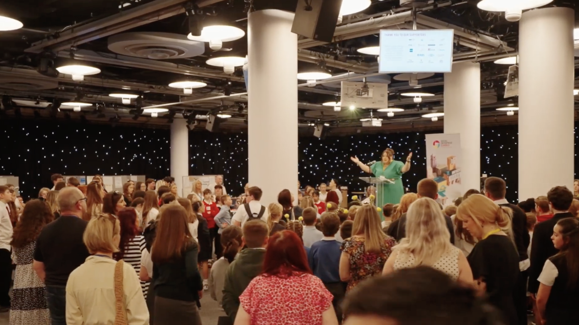 Audience facing presenter at Awards ceremony