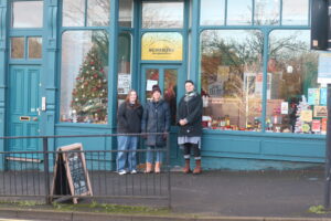 People standing outside the Sunshine Cooperative shop